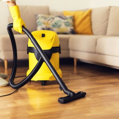woman-cleaning-sofa-with-yellow-vacuum-cleaner-copy-space-cleaning-service-concept-1.jpg